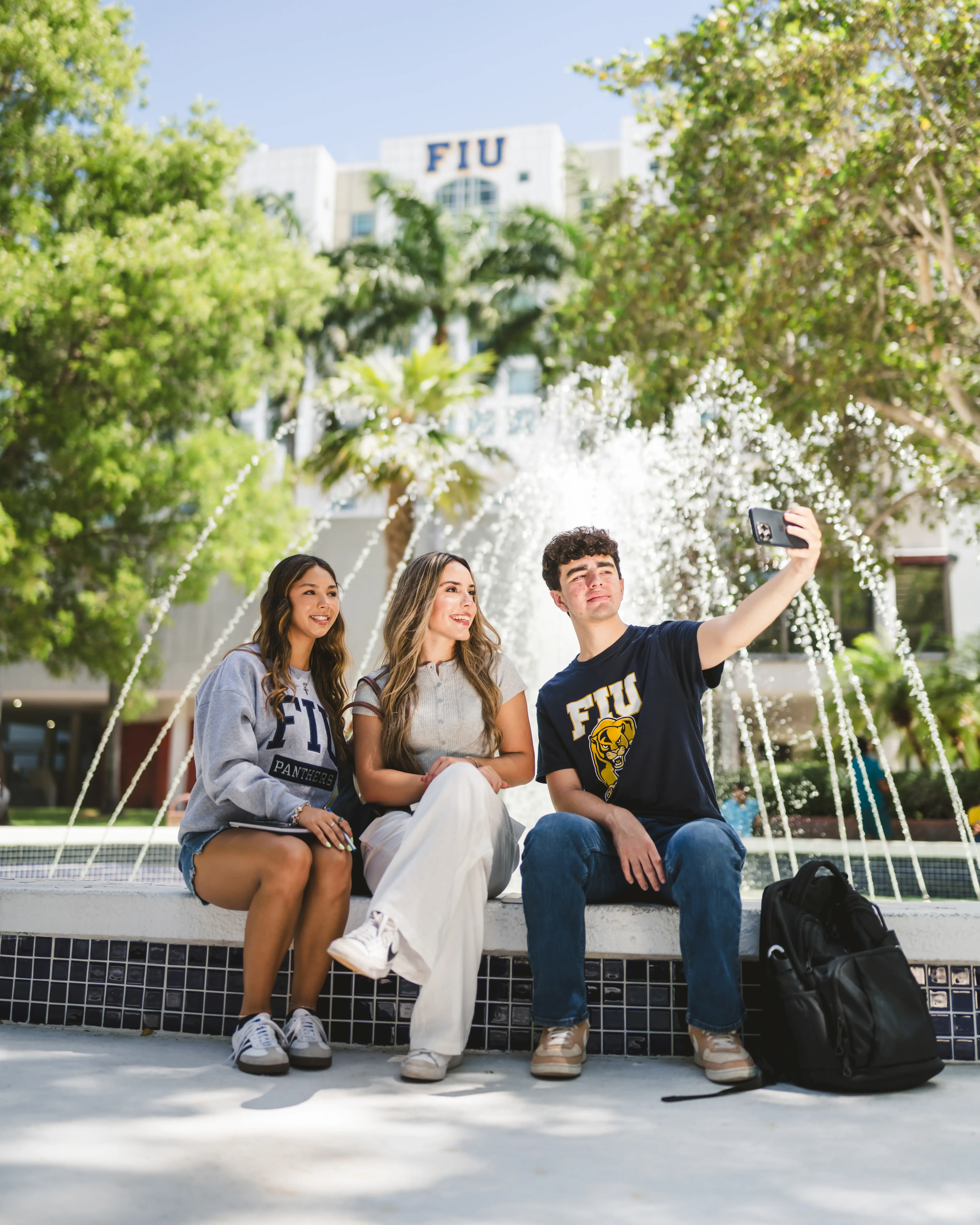 FIU students sitting by the GC fountains